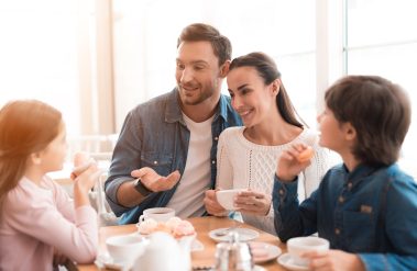 A,Young,Family,Came,Together,In,A,Cafe.,Mom,,Dad,